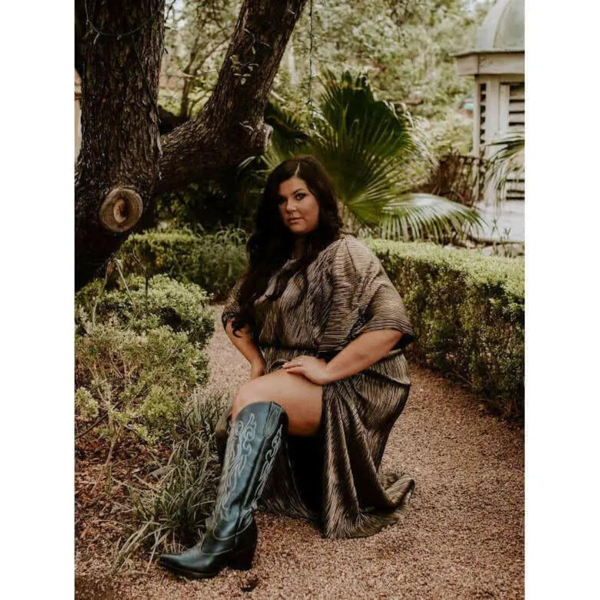 Black wide calf cowboy boots with white embroidery, luxury genuine leather, styled in garden