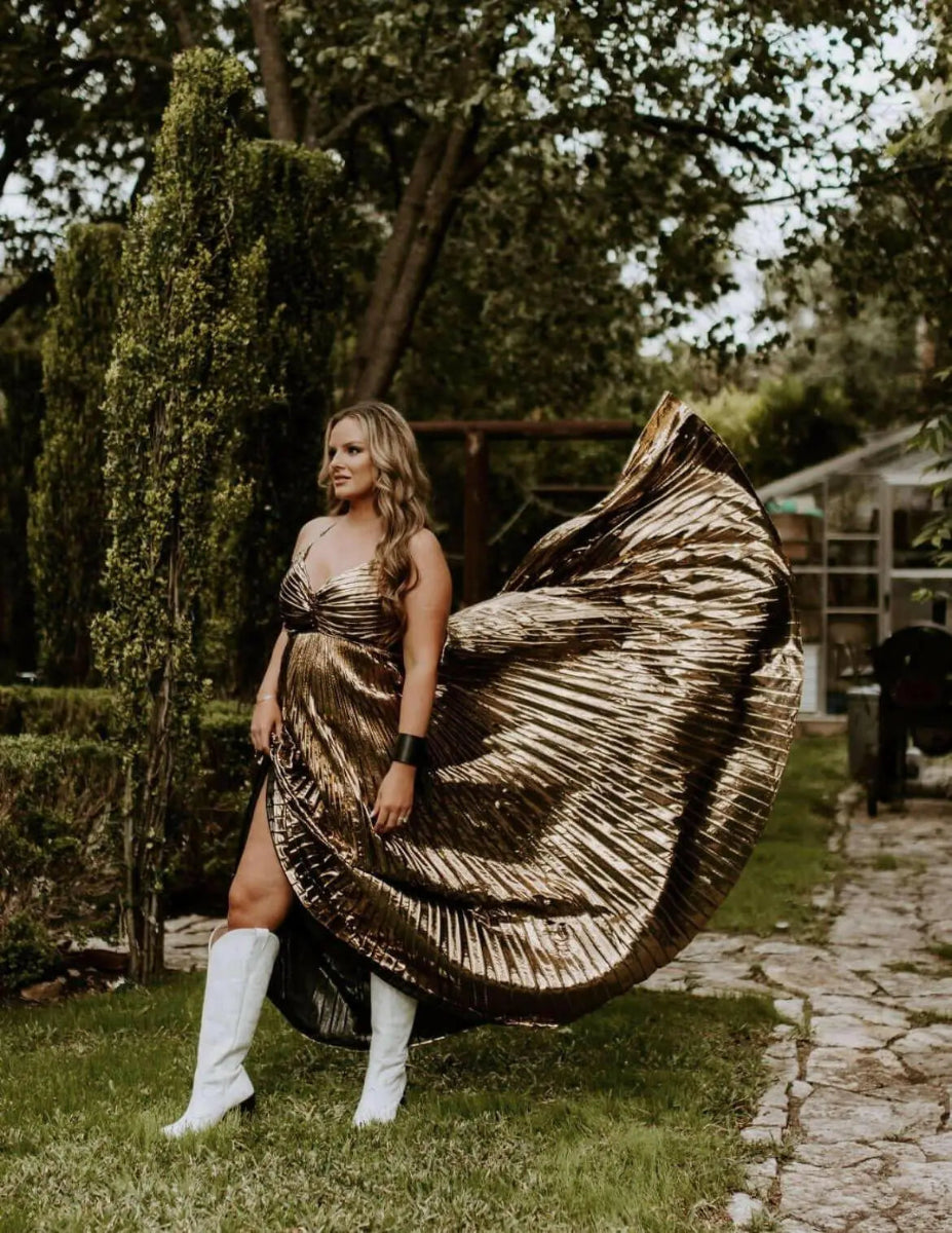 White wide calf heeled boots with genuine leather, styled with gold pleated dress in garden setting