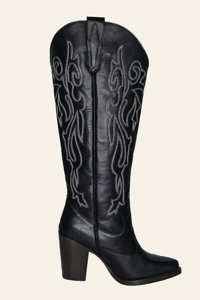 Right side view of Charlotte black leather boots with silver metallic stitching, showcasing their sleek silhouette and stylish western appeal.